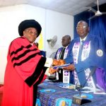 The Inaugural Lecturer, Prof. Olufemi Oloyede, presenting a copy of the 130th Inaugural Lecture to the Vice-Chancellor, Prof. Ayodeji Agboola.