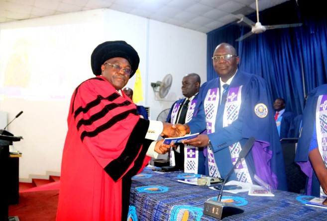 The Inaugural Lecturer, Prof. Olufemi Oloyede, presenting a copy of the 130th Inaugural Lecture to the Vice-Chancellor, Prof. Ayodeji Agboola.
