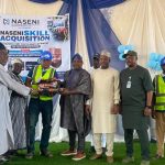 One of the beneficiaries receiving his starter pack.